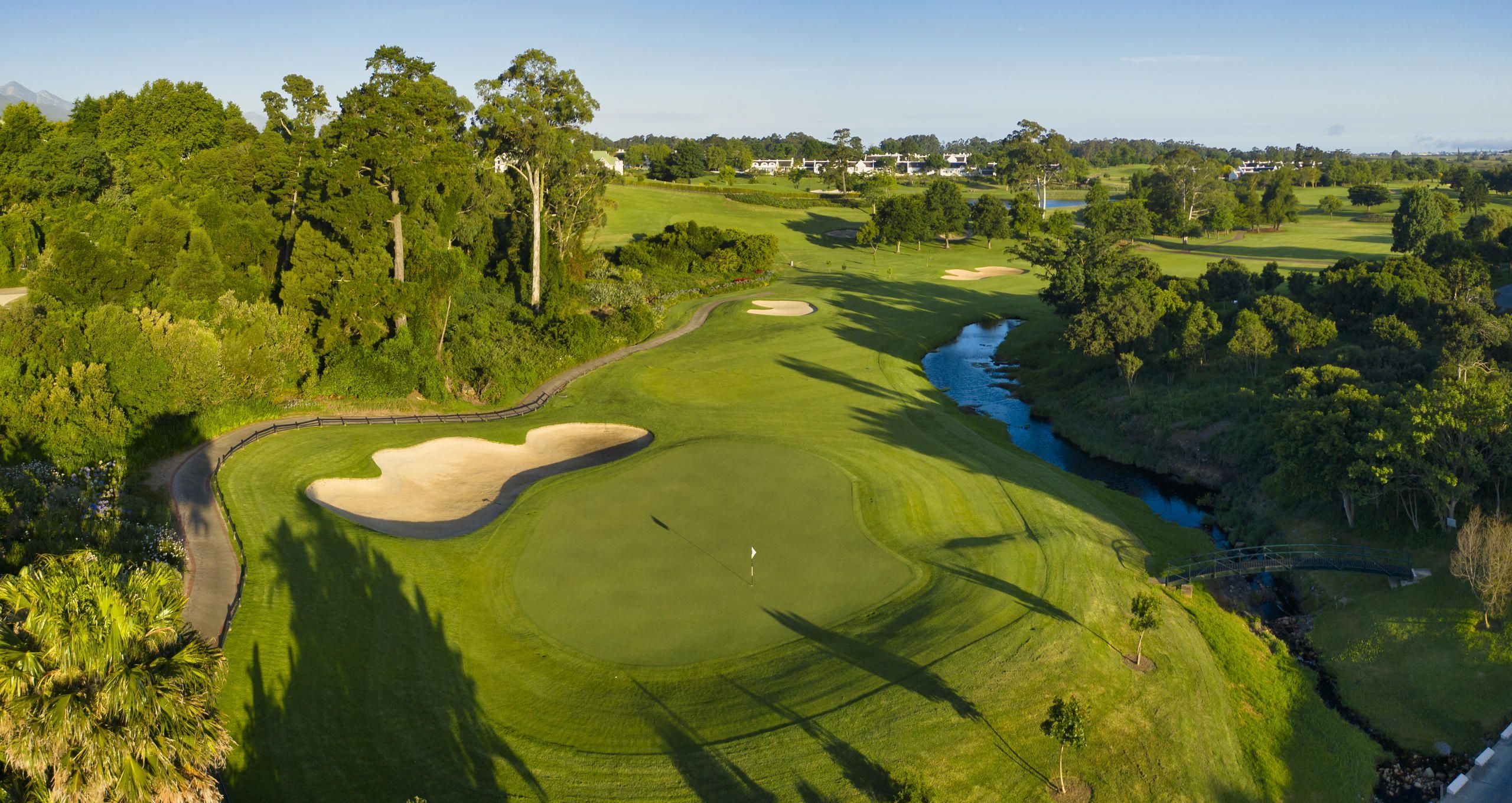 Fancourt Montagu Golf Course with manicured fairways and greens set against a scenic mountain backdrop.